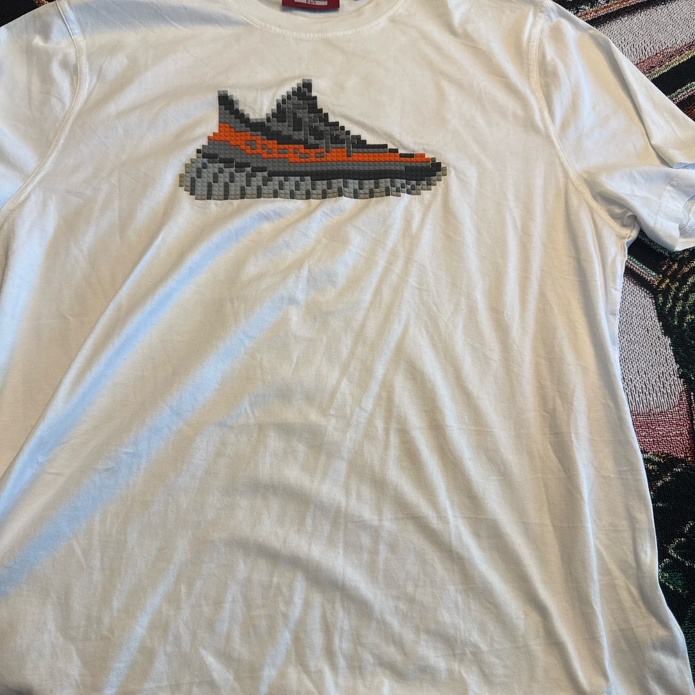 Mostly Heard Rarely Seen White Tee with Pixel Sneaker Design